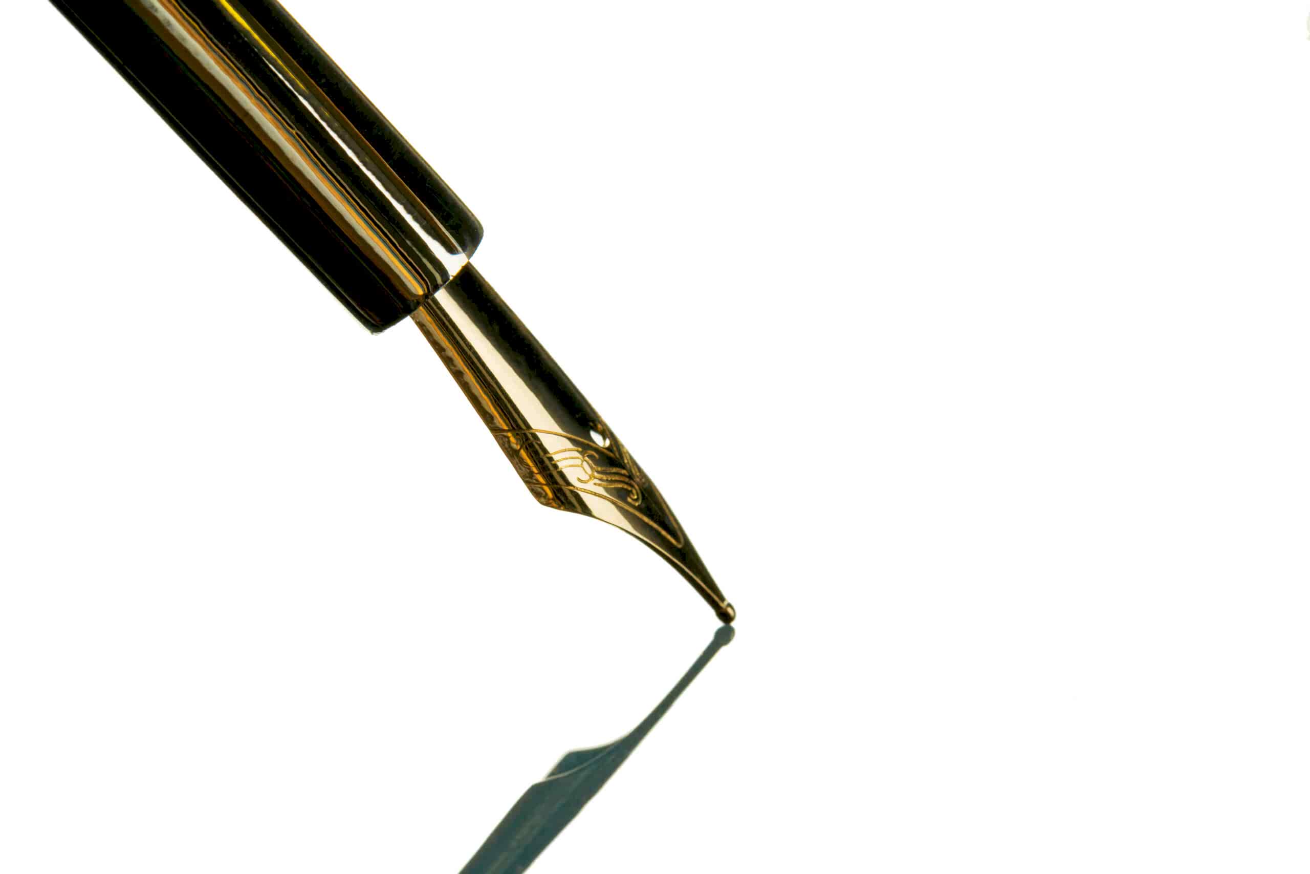 Vintage fountain pen close up on white